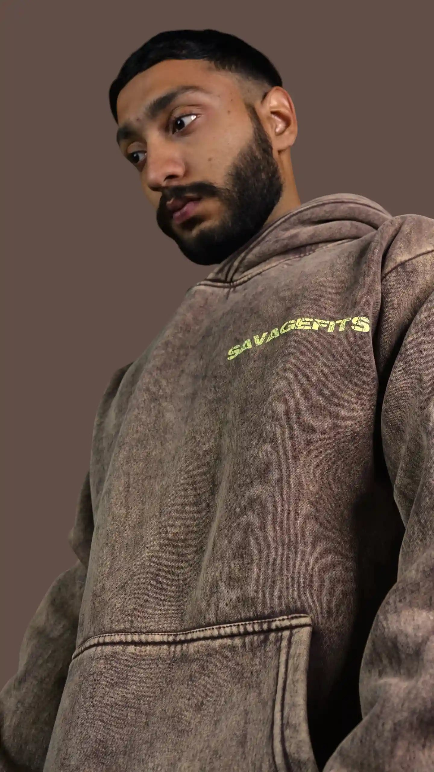 Person wearing a brown Acid wash hoodie with 'SAVAGE FITS' text on a brown background