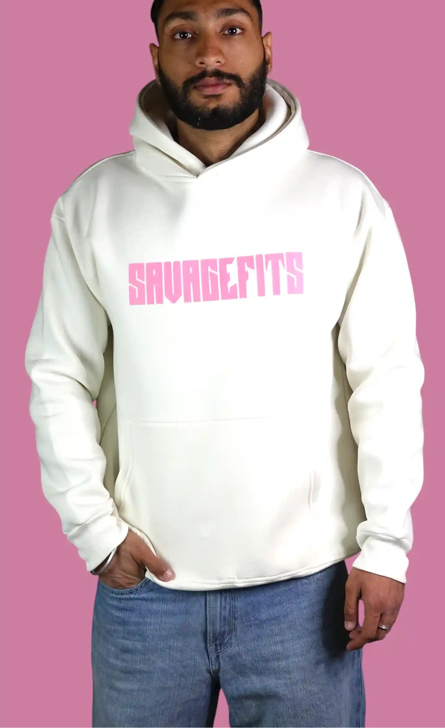 Man wearing a white hoodie with pink text on a pink background