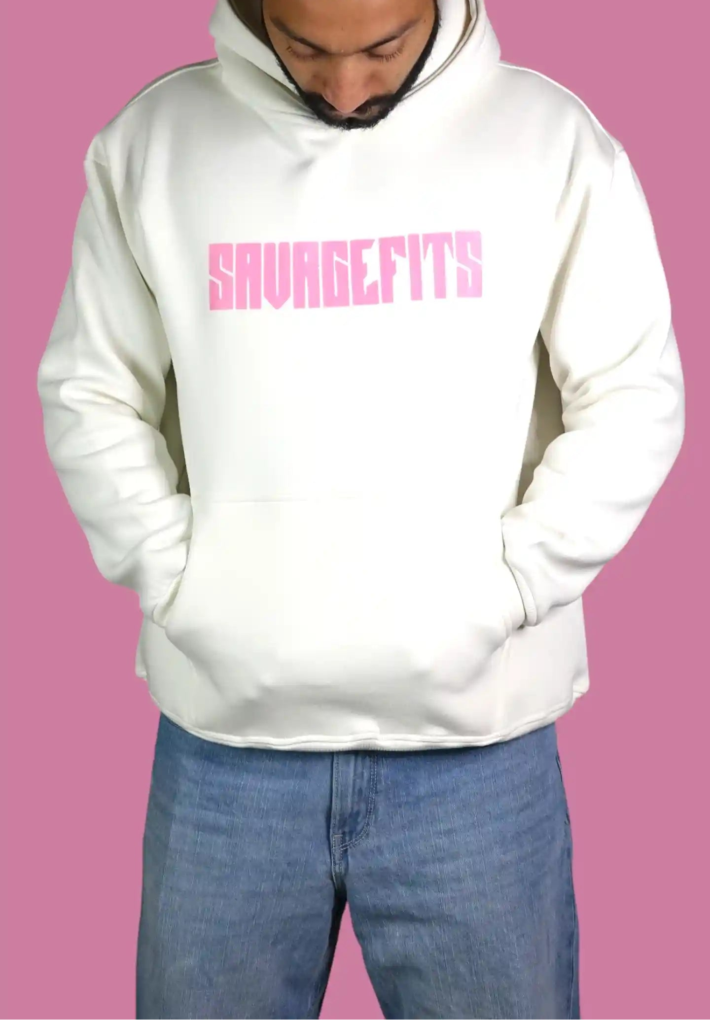 Person wearing a white hoodie with pink text on a pink background