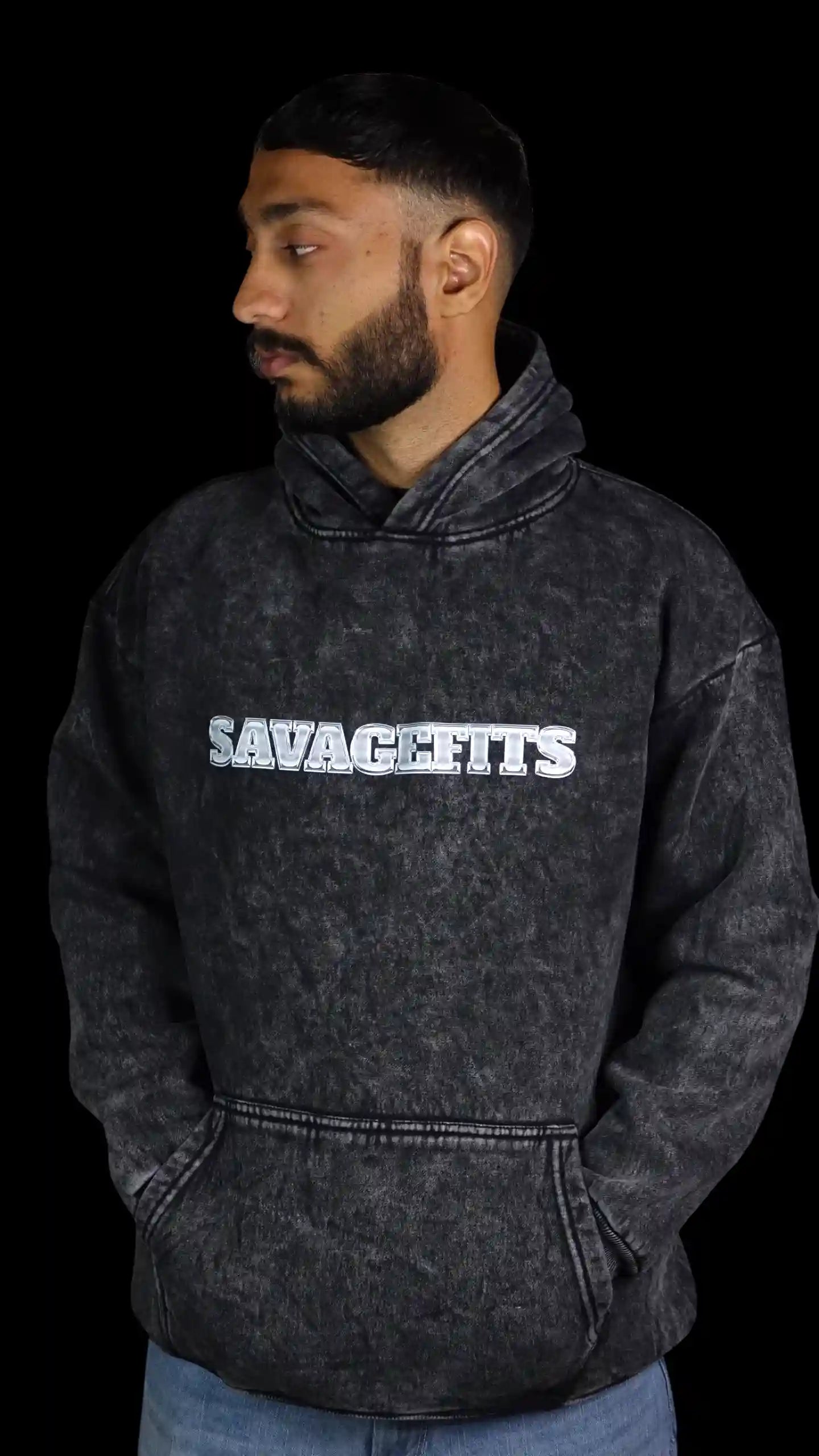 Person wearing a gray Acid wash hoodie with 'SAVAGEFITS' text on a black background