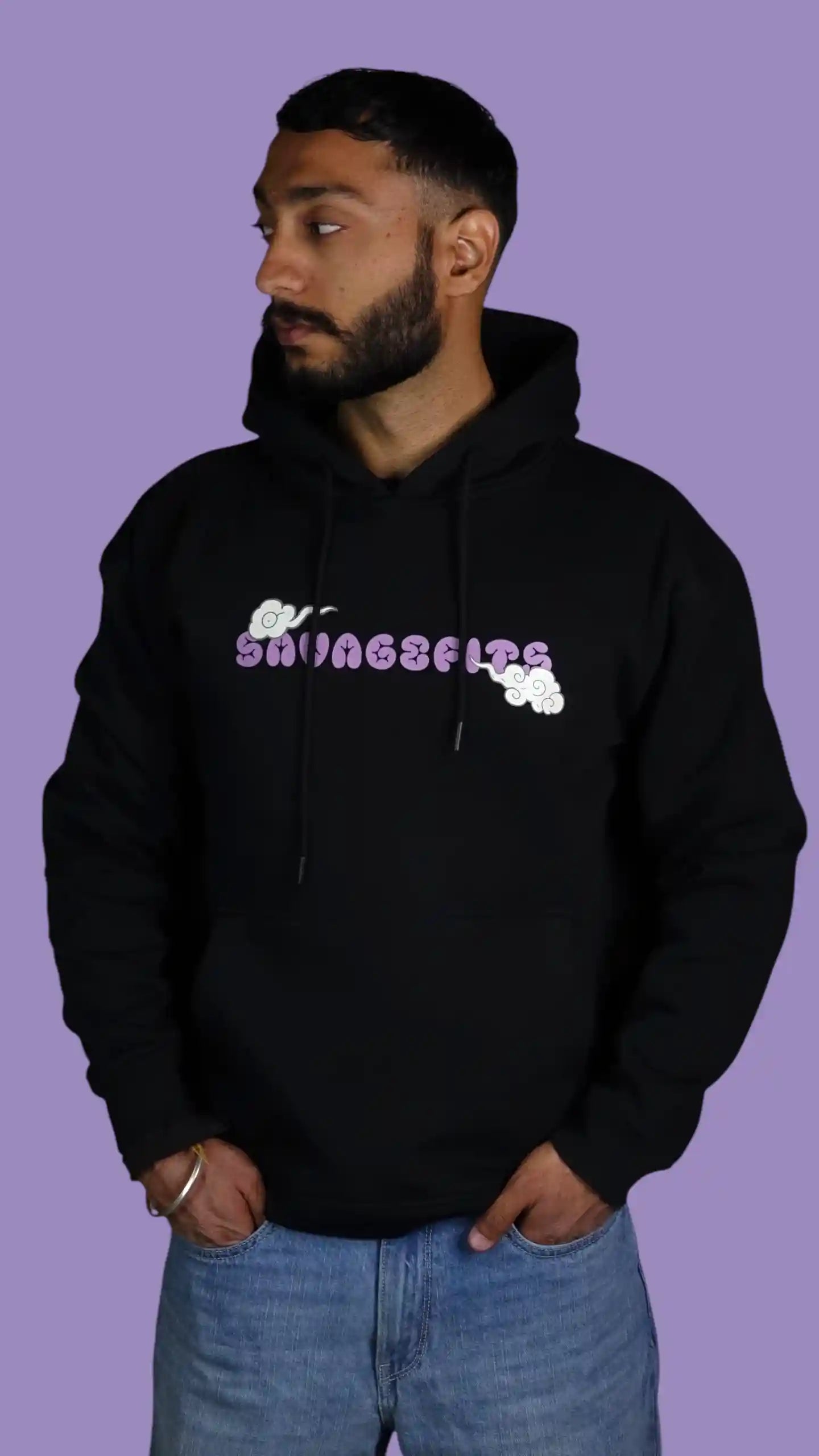 Person wearing a black hoodie with 'Savagefits' logo on a purple background