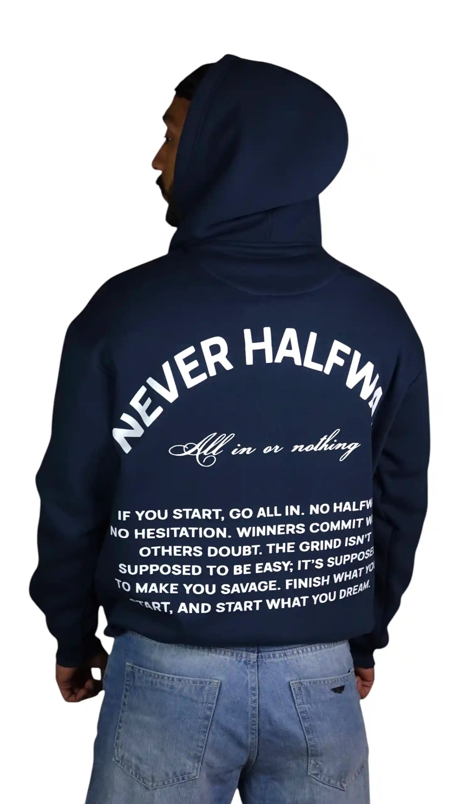 Person wearing a navy hoodie with motivational text on the back, standing against a white background